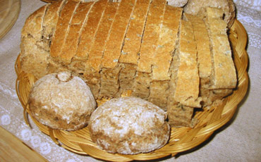 Assortment of baked bread in basket.