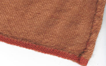 Red tablet woven band as the hem finishing.